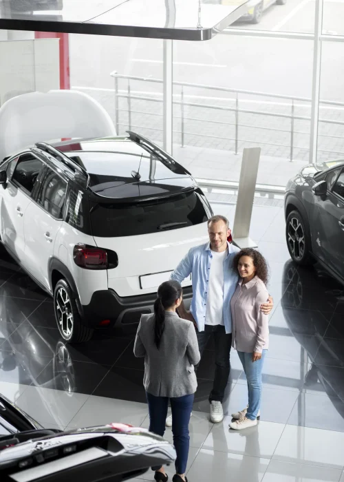 couple-searching-new-car-dealership